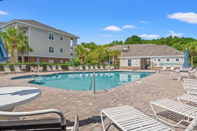 This charming 2-bedroom, 2-bathroom second-floor end unit is on Barefoot Resort and Golf Club  in South Carolina - for sale on GolfHomes.com, golf home, golf lot