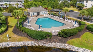 This charming 2-bedroom, 2-bathroom second-floor end unit is on Barefoot Resort and Golf Club  in South Carolina - for sale on GolfHomes.com, golf home, golf lot