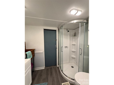 Welcome to lake living made easy in the highly sought-after on Old North State Club at Uwharrie Point Golf community in North Carolina - for sale on GolfHomes.com, golf home, golf lot