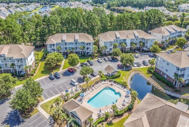 This charming 2-bedroom, 2-bathroom second-floor end unit is on Barefoot Resort and Golf Club  in South Carolina - for sale on GolfHomes.com, golf home, golf lot