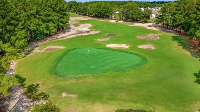 This charming 2-bedroom, 2-bathroom second-floor end unit is on Barefoot Resort and Golf Club  in South Carolina - for sale on GolfHomes.com, golf home, golf lot