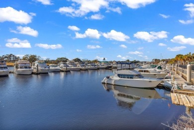 This charming 2-bedroom, 2-bathroom second-floor end unit is on Barefoot Resort and Golf Club  in South Carolina - for sale on GolfHomes.com, golf home, golf lot