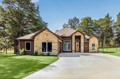 Exceptional 3-bed, 2.5-bath custom home on 2 lots in the gated on The Falls Resort and Club in Texas - for sale on GolfHomes.com, golf home, golf lot