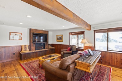 This stunning custom log home on Hole #1 of Aspen Hills Golf on Star Valley RV Golf Course in Wyoming - for sale on GolfHomes.com, golf home, golf lot