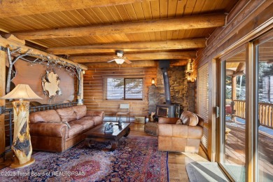 This stunning custom log home on Hole #1 of Aspen Hills Golf on Star Valley RV Golf Course in Wyoming - for sale on GolfHomes.com, golf home, golf lot