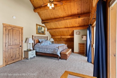 This stunning custom log home on Hole #1 of Aspen Hills Golf on Star Valley RV Golf Course in Wyoming - for sale on GolfHomes.com, golf home, golf lot