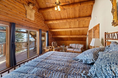 This stunning custom log home on Hole #1 of Aspen Hills Golf on Star Valley RV Golf Course in Wyoming - for sale on GolfHomes.com, golf home, golf lot