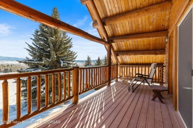 This stunning custom log home on Hole #1 of Aspen Hills Golf on Star Valley RV Golf Course in Wyoming - for sale on GolfHomes.com, golf home, golf lot