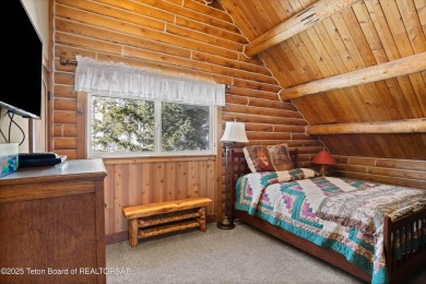 This stunning custom log home on Hole #1 of Aspen Hills Golf on Star Valley RV Golf Course in Wyoming - for sale on GolfHomes.com, golf home, golf lot