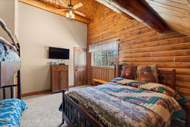 This stunning custom log home on Hole #1 of Aspen Hills Golf on Star Valley RV Golf Course in Wyoming - for sale on GolfHomes.com, golf home, golf lot