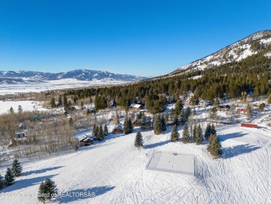 This stunning custom log home on Hole #1 of Aspen Hills Golf on Star Valley RV Golf Course in Wyoming - for sale on GolfHomes.com, golf home, golf lot