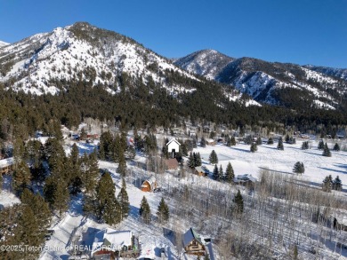 This stunning custom log home on Hole #1 of Aspen Hills Golf on Star Valley RV Golf Course in Wyoming - for sale on GolfHomes.com, golf home, golf lot