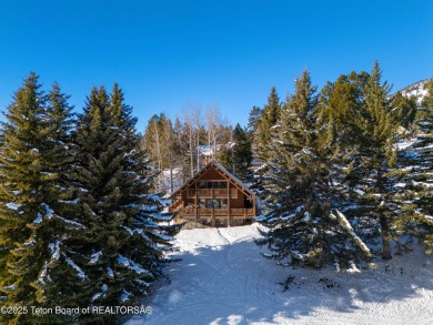 This stunning custom log home on Hole #1 of Aspen Hills Golf on Star Valley RV Golf Course in Wyoming - for sale on GolfHomes.com, golf home, golf lot