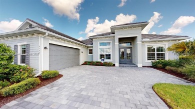 This stunning home boasts panoramic views of the lake and golf on Panther Run Golf Club in Florida - for sale on GolfHomes.com, golf home, golf lot