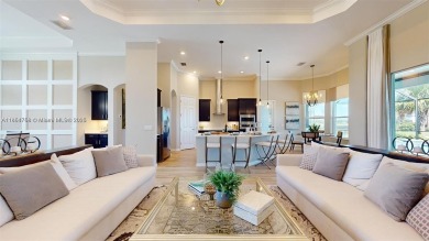 This stunning home boasts panoramic views of the lake and golf on Panther Run Golf Club in Florida - for sale on GolfHomes.com, golf home, golf lot