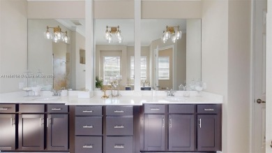 This stunning home boasts panoramic views of the lake and golf on Panther Run Golf Club in Florida - for sale on GolfHomes.com, golf home, golf lot