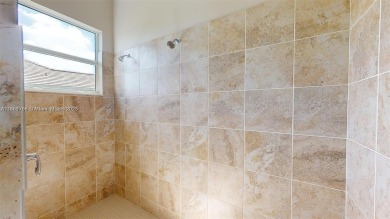 This stunning home boasts panoramic views of the lake and golf on Panther Run Golf Club in Florida - for sale on GolfHomes.com, golf home, golf lot