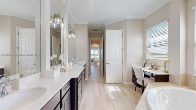 This stunning home boasts panoramic views of the lake and golf on Panther Run Golf Club in Florida - for sale on GolfHomes.com, golf home, golf lot