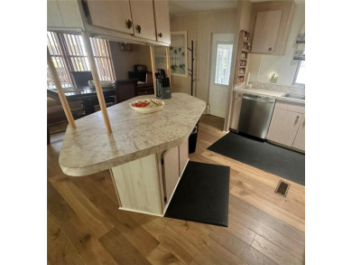 Enjoy a home and your own golf cart in the active 55+ community on Riverwood Golf Club in Florida - for sale on GolfHomes.com, golf home, golf lot