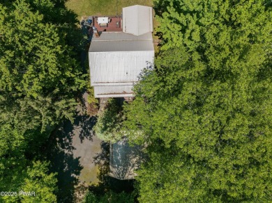 Welcome to your serene lakeside retreat in the highly desirable on Paupack Hills Golf and Country Club in Pennsylvania - for sale on GolfHomes.com, golf home, golf lot