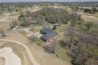 This impressive, full-brick home is locatd on a spacious golf on The Bald Eagle Course At Eagle Creek Golf Club in Missouri - for sale on GolfHomes.com, golf home, golf lot
