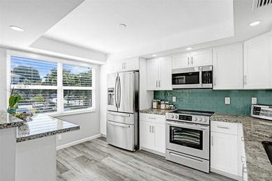 Renovated CORNER 2 bed/2 bath 1291 sq. ft residence located in on Wynmoor Golf Course in Florida - for sale on GolfHomes.com, golf home, golf lot