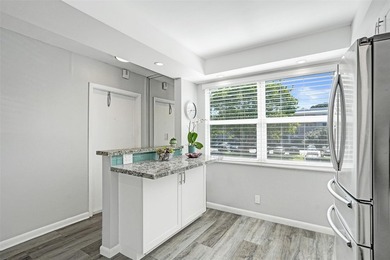 Renovated CORNER 2 bed/2 bath 1291 sq. ft residence located in on Wynmoor Golf Course in Florida - for sale on GolfHomes.com, golf home, golf lot