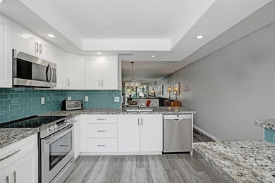 Renovated CORNER 2 bed/2 bath 1291 sq. ft residence located in on Wynmoor Golf Course in Florida - for sale on GolfHomes.com, golf home, golf lot