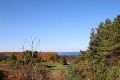 SPECTACULAR LAKE MICHIGAN VIEWS with beautiful views of the on Crooked Tree Golf Club in Michigan - for sale on GolfHomes.com, golf home, golf lot