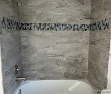 One or more photos are virtually staged. Seller is Very on Pine Ridge Community Golf and Country Club in Florida - for sale on GolfHomes.com, golf home, golf lot
