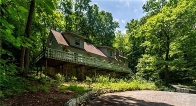 This contemporary mountain home situated on a private wooded lot on Mt. Mitchell Golf Course in North Carolina - for sale on GolfHomes.com, golf home, golf lot
