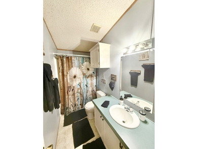 This spacious 4-bedroom, 2.5-bath home sits on a large corner on Pendleton Harbor in Texas - for sale on GolfHomes.com, golf home, golf lot