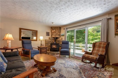 This contemporary mountain home situated on a private wooded lot on Mt. Mitchell Golf Course in North Carolina - for sale on GolfHomes.com, golf home, golf lot