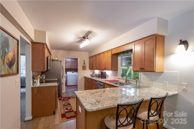 This contemporary mountain home situated on a private wooded lot on Mt. Mitchell Golf Course in North Carolina - for sale on GolfHomes.com, golf home, golf lot