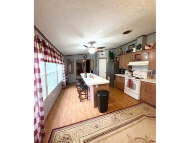 This spacious 4-bedroom, 2.5-bath home sits on a large corner on Pendleton Harbor in Texas - for sale on GolfHomes.com, golf home, golf lot