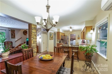 This contemporary mountain home situated on a private wooded lot on Mt. Mitchell Golf Course in North Carolina - for sale on GolfHomes.com, golf home, golf lot