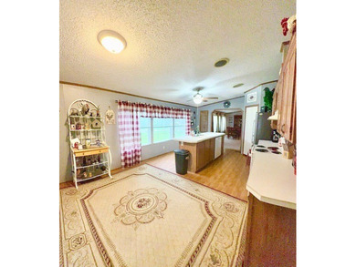 This spacious 4-bedroom, 2.5-bath home sits on a large corner on Pendleton Harbor in Texas - for sale on GolfHomes.com, golf home, golf lot