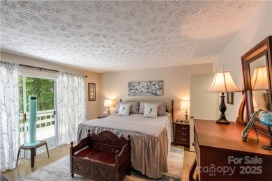 This contemporary mountain home situated on a private wooded lot on Mt. Mitchell Golf Course in North Carolina - for sale on GolfHomes.com, golf home, golf lot