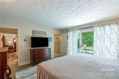 This contemporary mountain home situated on a private wooded lot on Mt. Mitchell Golf Course in North Carolina - for sale on GolfHomes.com, golf home, golf lot