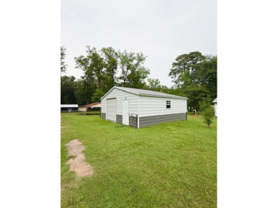 This spacious 4-bedroom, 2.5-bath home sits on a large corner on Pendleton Harbor in Texas - for sale on GolfHomes.com, golf home, golf lot