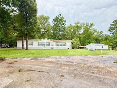 This spacious 4-bedroom, 2.5-bath home sits on a large corner on Pendleton Harbor in Texas - for sale on GolfHomes.com, golf home, golf lot