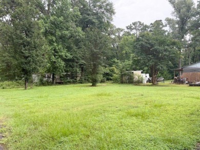 This spacious 4-bedroom, 2.5-bath home sits on a large corner on Pendleton Harbor in Texas - for sale on GolfHomes.com, golf home, golf lot