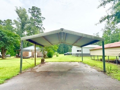 This spacious 4-bedroom, 2.5-bath home sits on a large corner on Pendleton Harbor in Texas - for sale on GolfHomes.com, golf home, golf lot