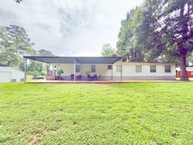 This spacious 4-bedroom, 2.5-bath home sits on a large corner on Pendleton Harbor in Texas - for sale on GolfHomes.com, golf home, golf lot