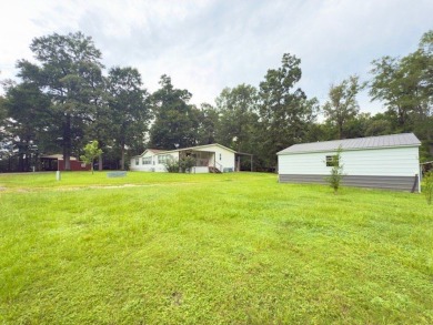 This spacious 4-bedroom, 2.5-bath home sits on a large corner on Pendleton Harbor in Texas - for sale on GolfHomes.com, golf home, golf lot