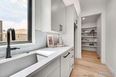 Entertainer's delight perched on a premier .25-acre lot in the on Coal Creek Golf Course in Colorado - for sale on GolfHomes.com, golf home, golf lot