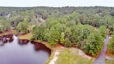 Beautiful wooded 0.34-acre lot located in the desirable Carolina on Carolina Lakes Country Club in North Carolina - for sale on GolfHomes.com, golf home, golf lot
