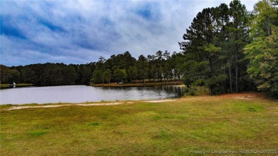 Beautiful wooded 0.34-acre lot located in the desirable Carolina on Carolina Lakes Country Club in North Carolina - for sale on GolfHomes.com, golf home, golf lot