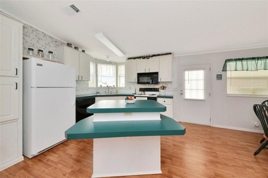 Pristine and move-in ready in Golf Lakes, a gated 55+ on Heather Hills Golf Course in Florida - for sale on GolfHomes.com, golf home, golf lot