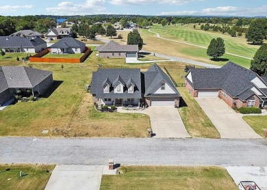 This charming 4-bedroom, 2-bath home in Patricia Island Country on Patricia Island Golf Club in Oklahoma - for sale on GolfHomes.com, golf home, golf lot
